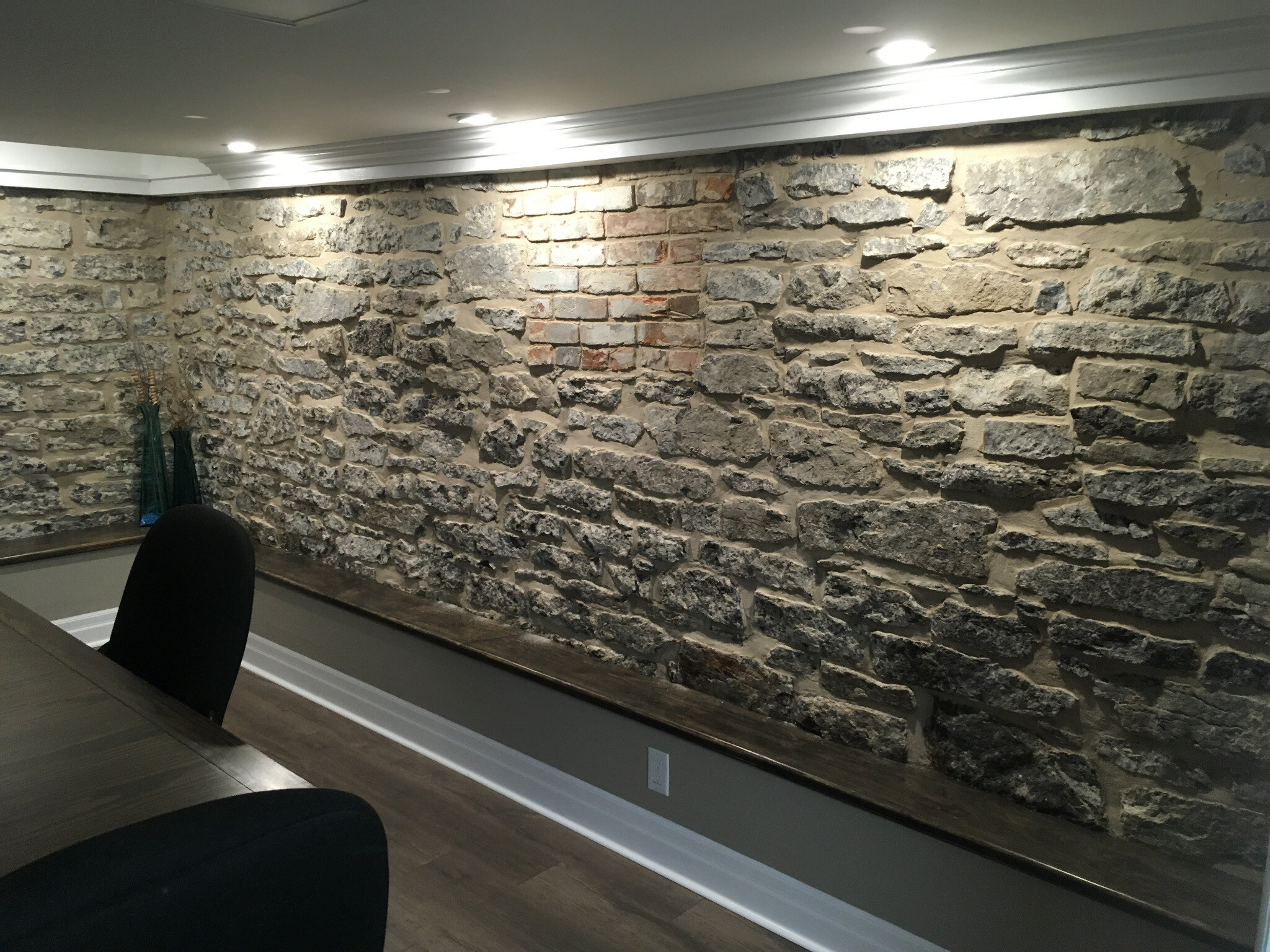 Finished exposed limestone wall restored by Stone Worx Masonry