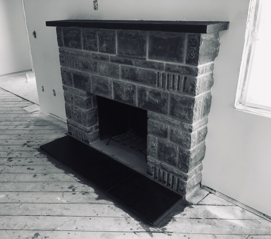 Custom masonry fireplace with detailed brickwork