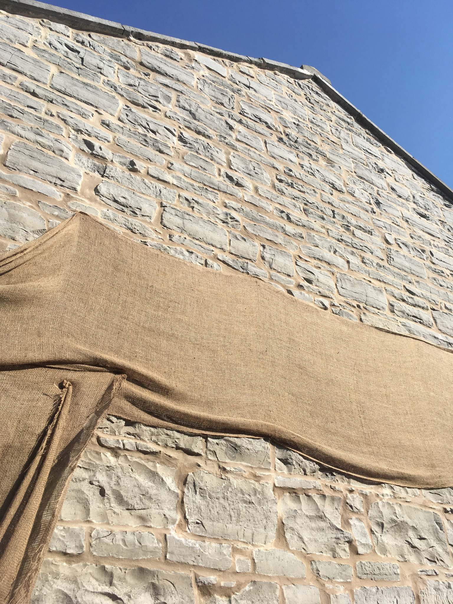 Freshly repointed historic limestone wall